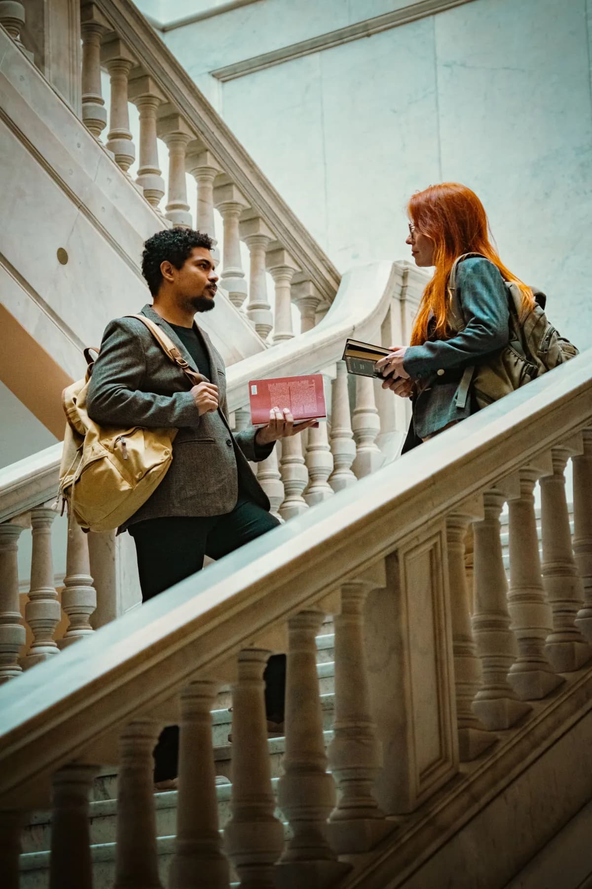 Two students talking on steps in Berlin